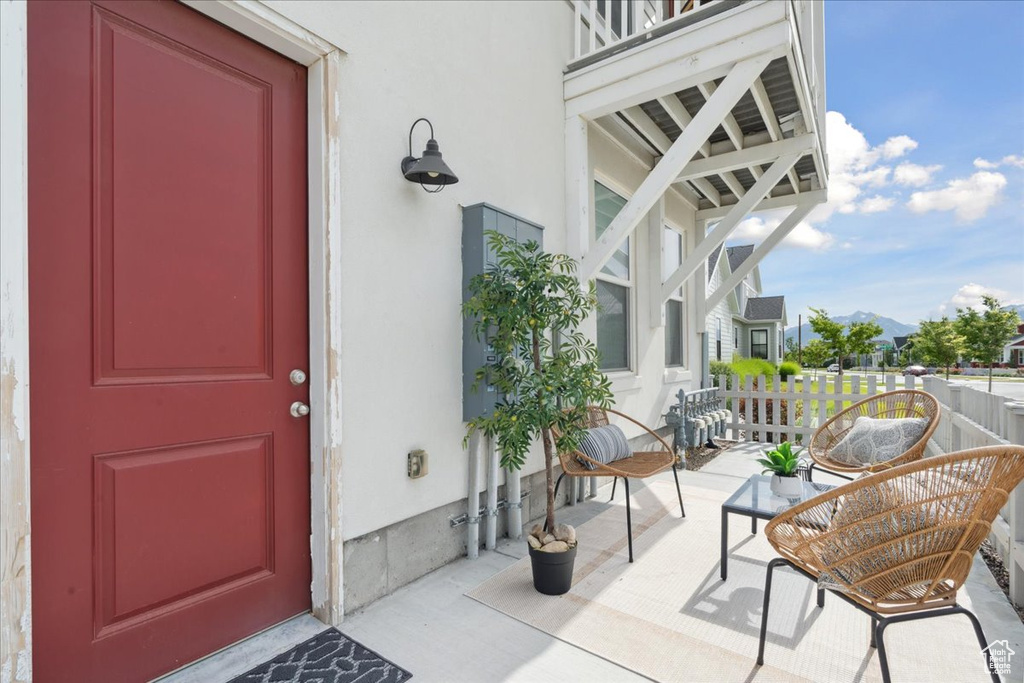 Doorway to property with stucco siding and a mountain view