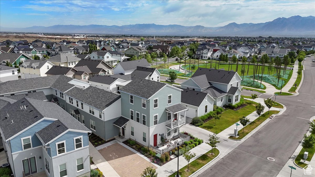 Aerial perspective of suburban area with a mountainous background