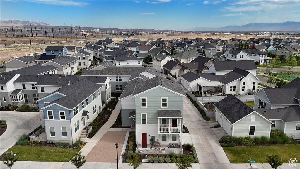 Aerial perspective of suburban area with a mountain backdrop