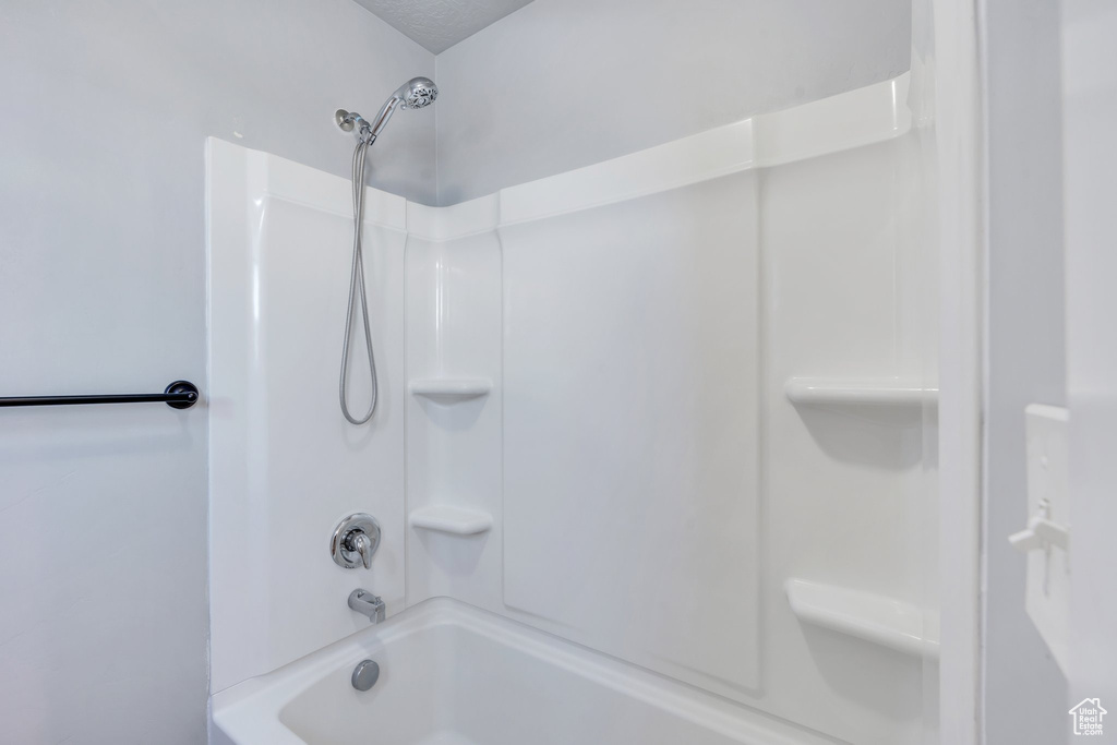 Full bathroom with shower / bath combination