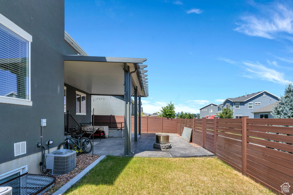 Fenced backyard with a patio area