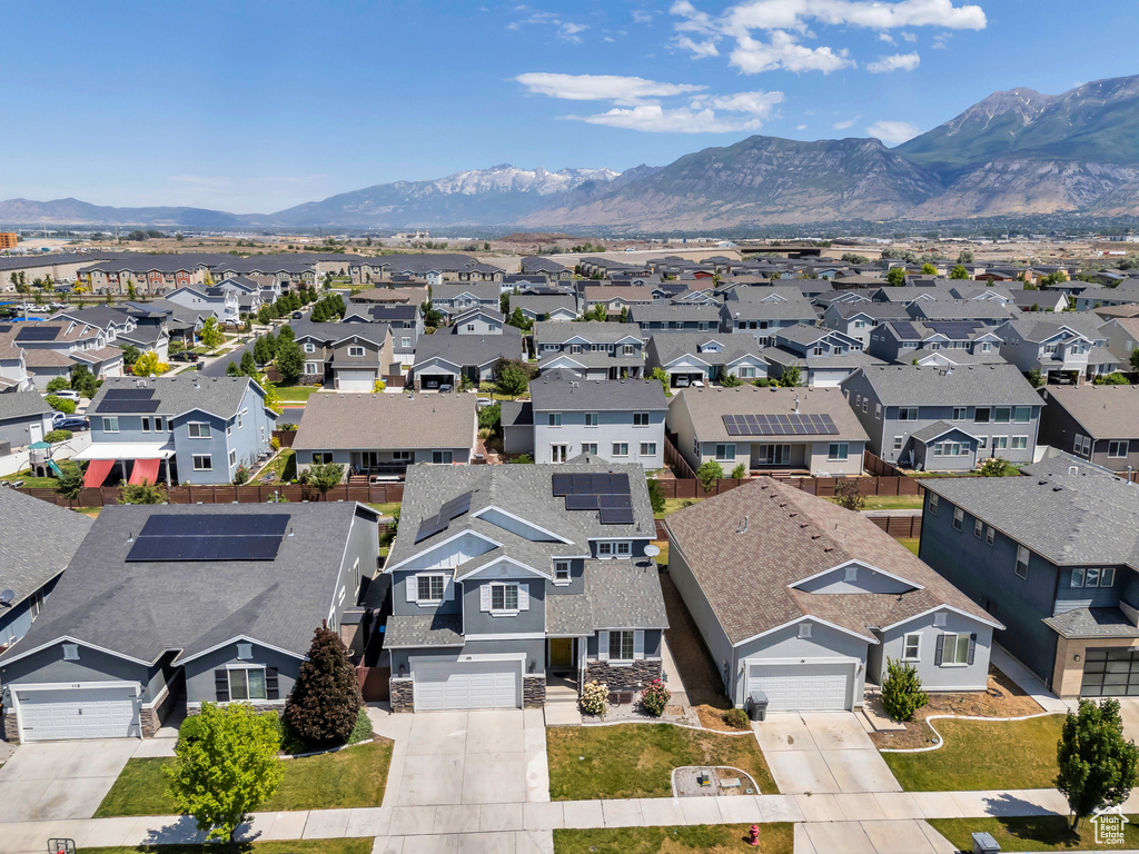 Aerial view of residential area featuring mountains