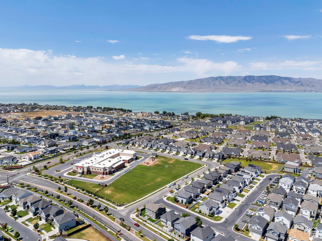 Aerial perspective of suburban area featuring a water and mountain view