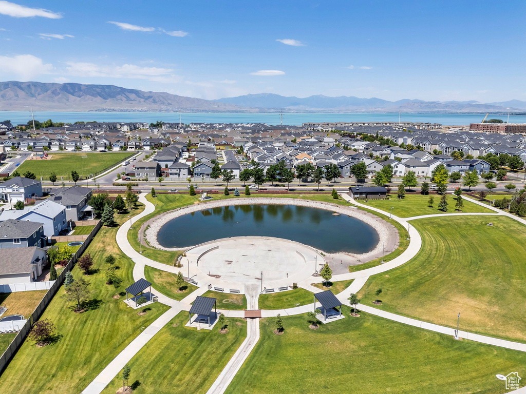 Aerial view of property\'s location featuring a water and mountain view and nearby suburban area