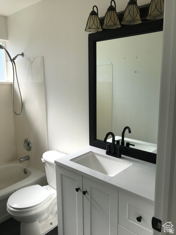 Bathroom featuring vanity and bathing tub / shower combination