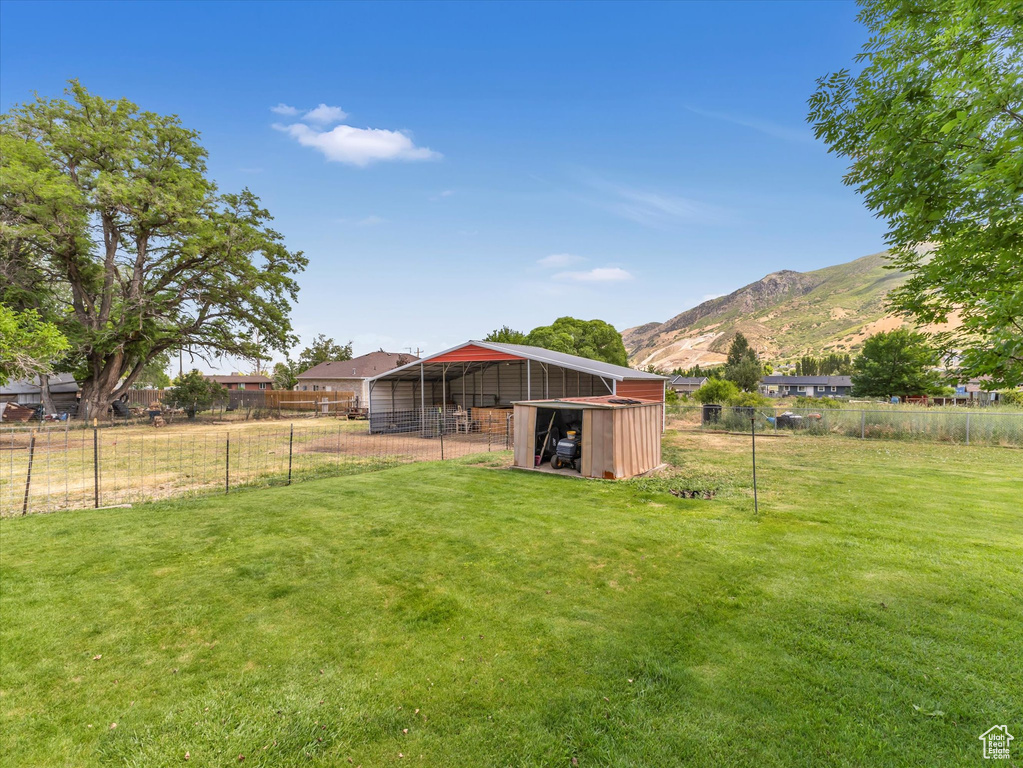 View of yard featuring an outbuilding and a mountain view