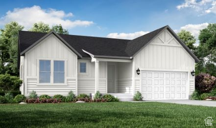 View of front of property featuring board and batten siding, a garage, a front lawn, and concrete driveway