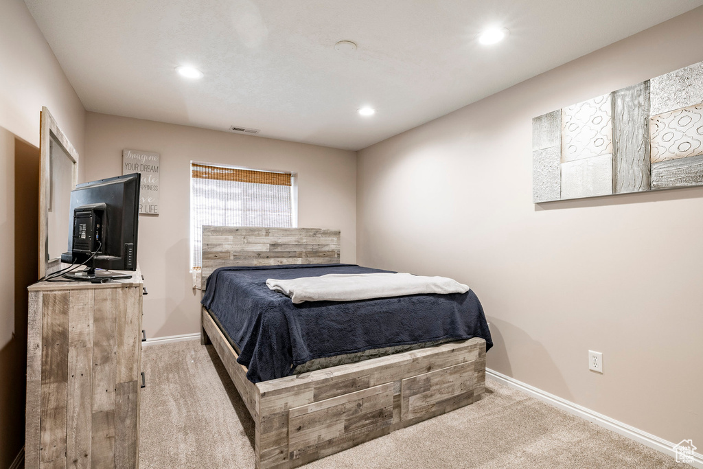 Bedroom with carpet floors and recessed lighting