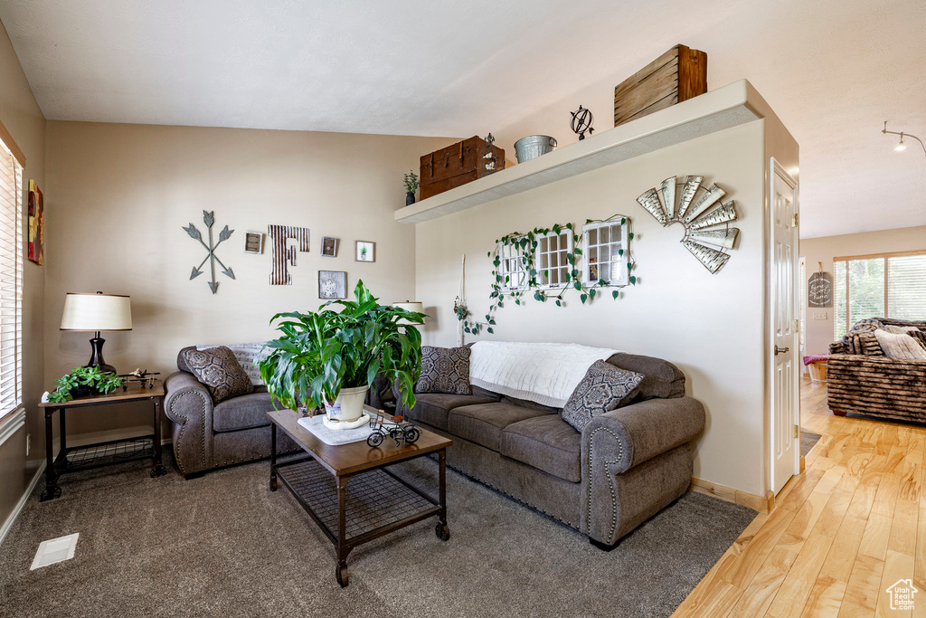 Living room featuring light wood-style floors and baseboards