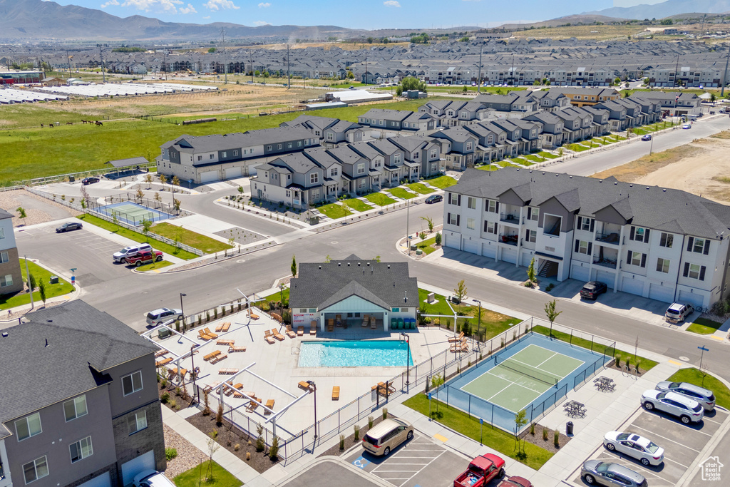 Aerial view of a pool area and a mountainous background