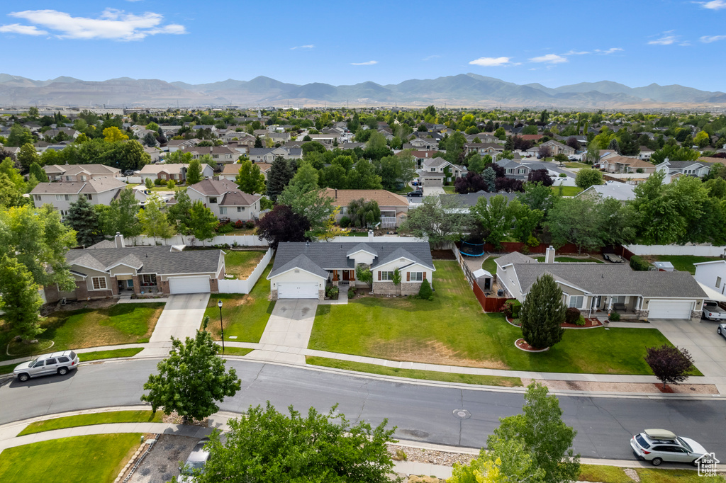Aerial perspective of suburban area featuring a mountainous background