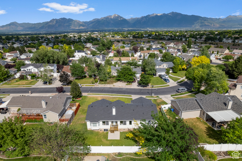 Aerial perspective of suburban area featuring a mountainous background