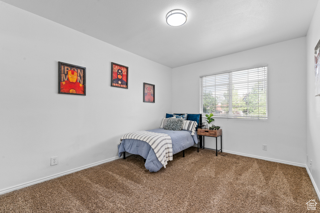 Carpeted bedroom with baseboards