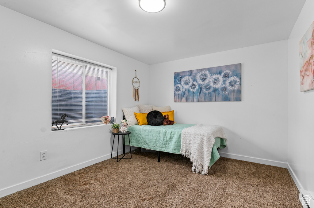 Carpeted bedroom with baseboards