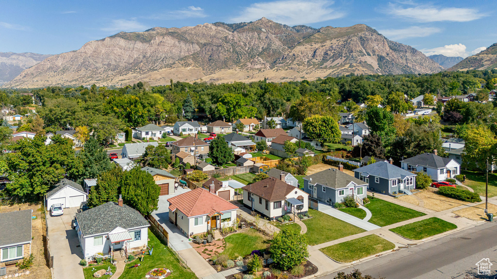 Aerial view of residential area featuring mountains