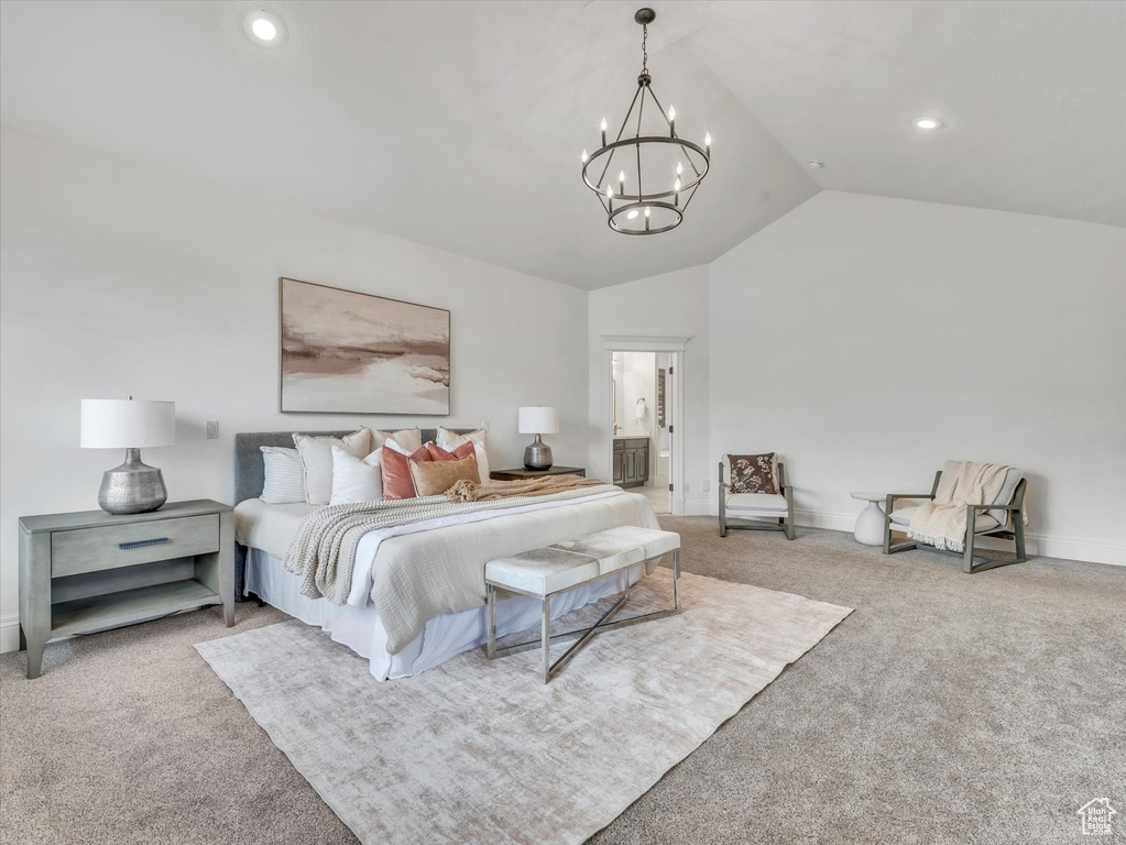 Bedroom featuring carpet flooring, vaulted ceiling, a chandelier, recessed lighting, and connected bathroom