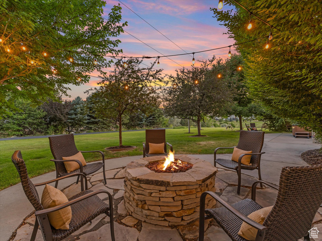 View of patio featuring a fire pit