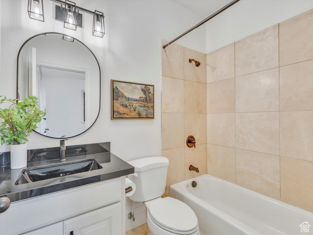 Bathroom featuring shower / bath combination and vanity