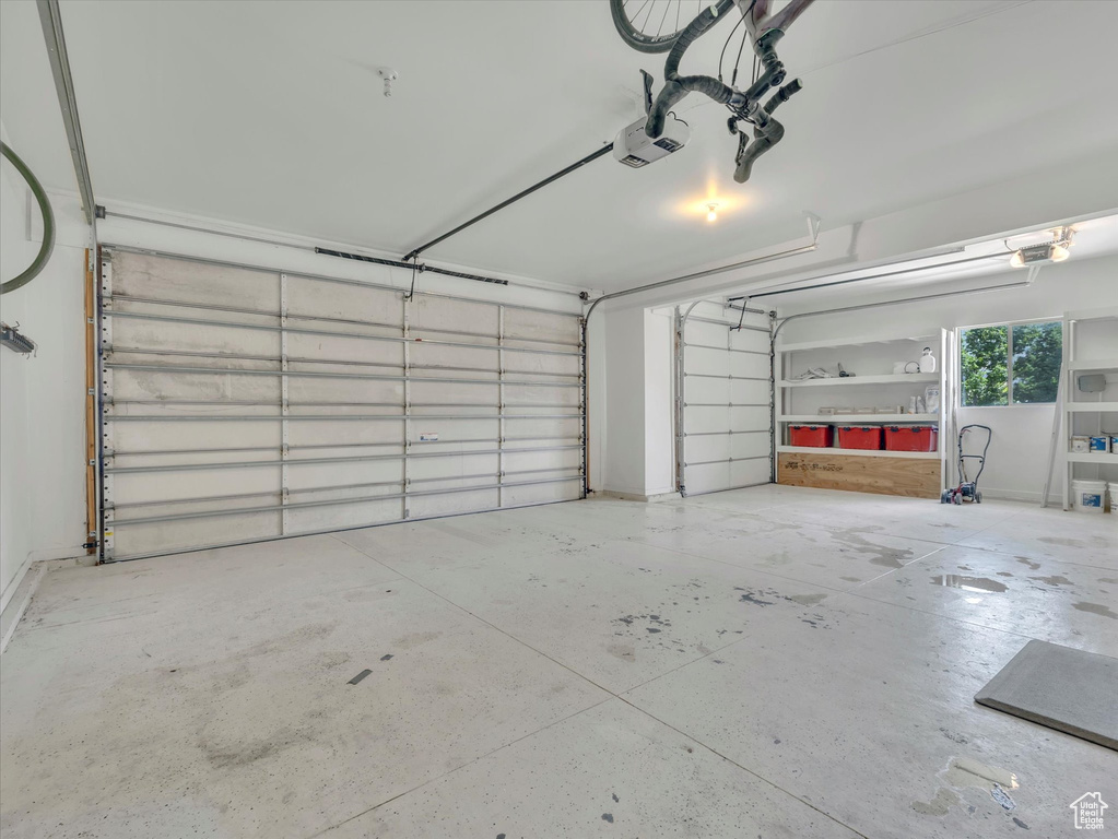 Garage featuring a garage door opener