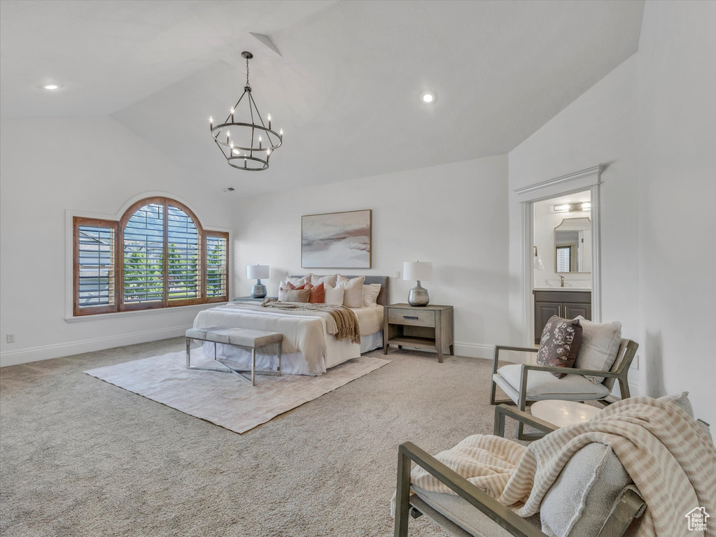 Bedroom with light colored carpet, a chandelier, high vaulted ceiling, and recessed lighting