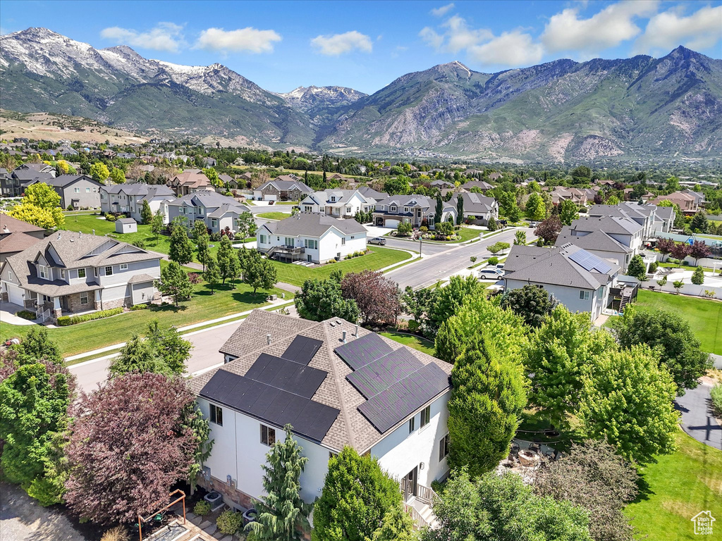 Aerial view of residential area featuring a mountainous background
