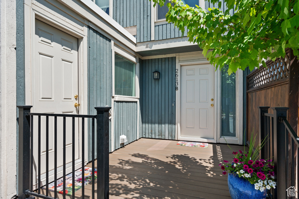 Property entrance featuring board and batten siding