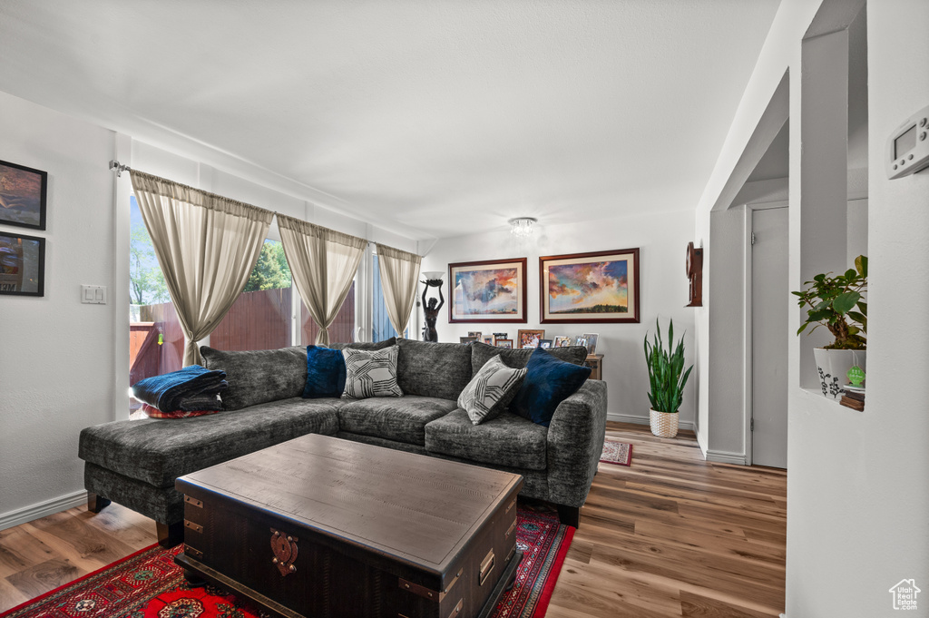 Living room with wood finished floors and baseboards