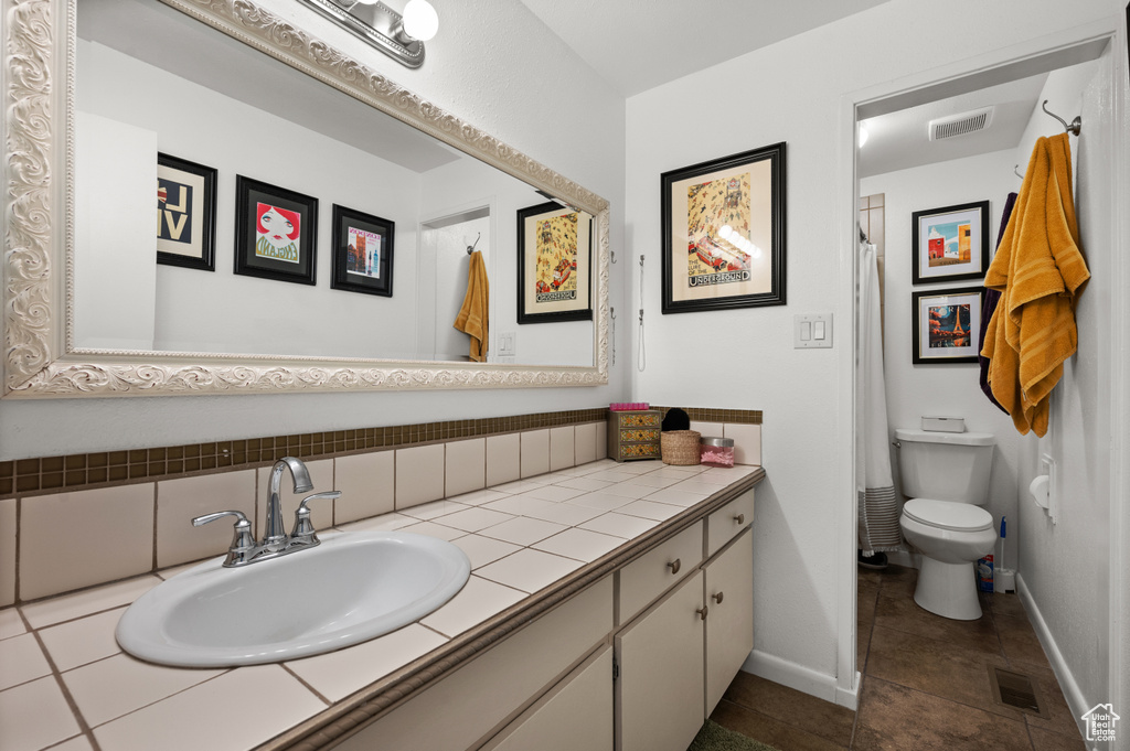 Full bath featuring vanity and a shower with curtain