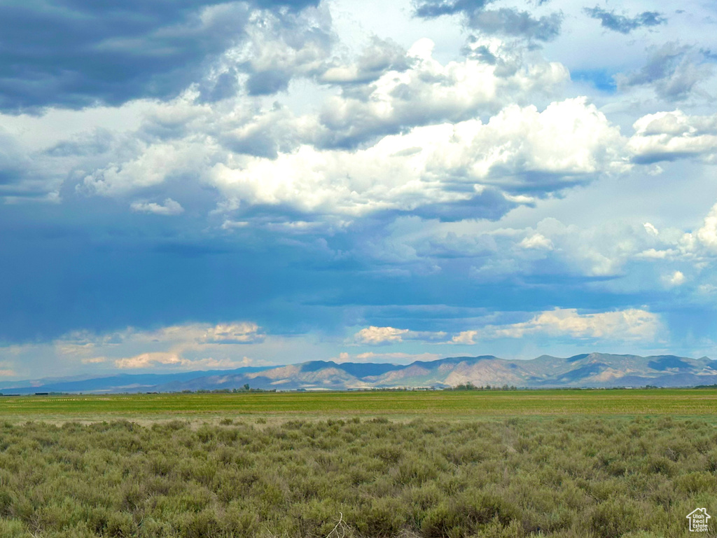 View of mountain background featuring rural landscape