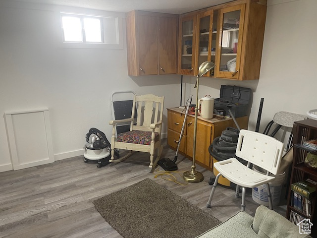 Sitting room featuring wood finished floors and baseboards