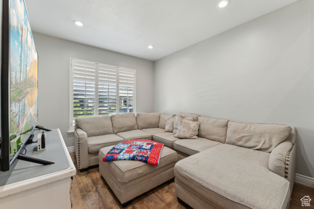 Living area with recessed lighting and wood finished floors