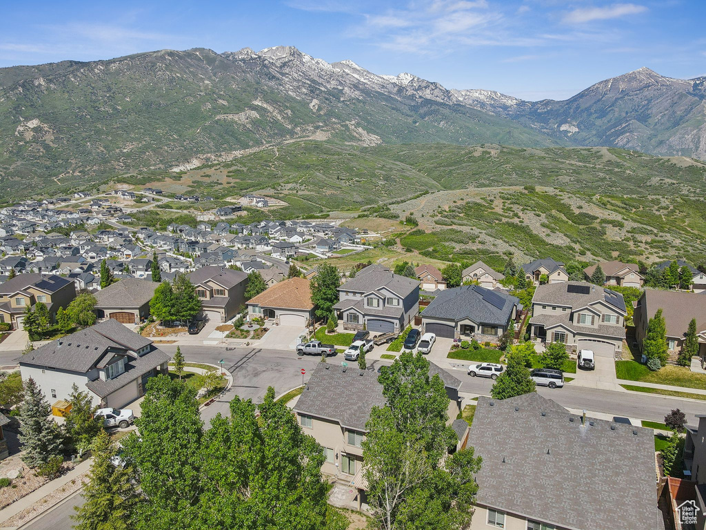Aerial perspective of suburban area featuring a mountainous background