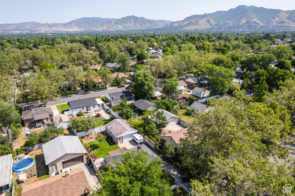Aerial view of residential area featuring a mountain backdrop