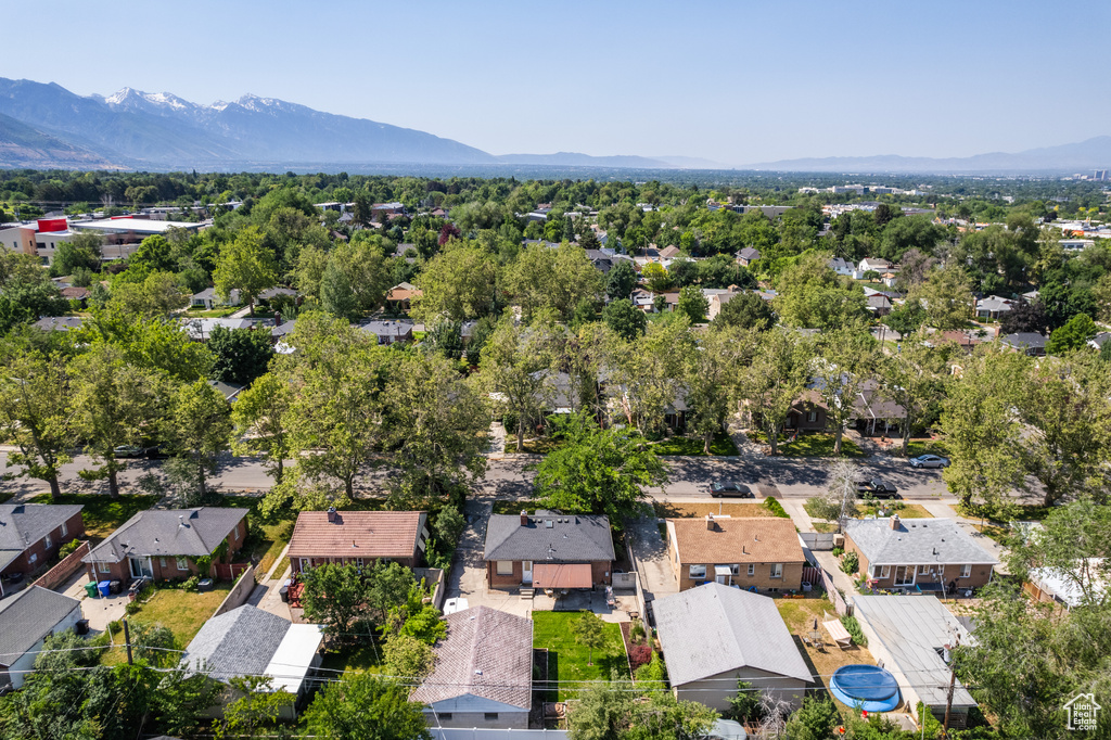Aerial perspective of suburban area featuring a mountainous background