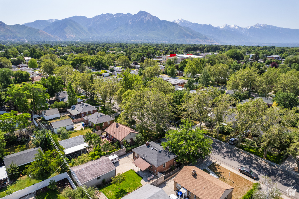 Aerial perspective of suburban area featuring a mountain backdrop