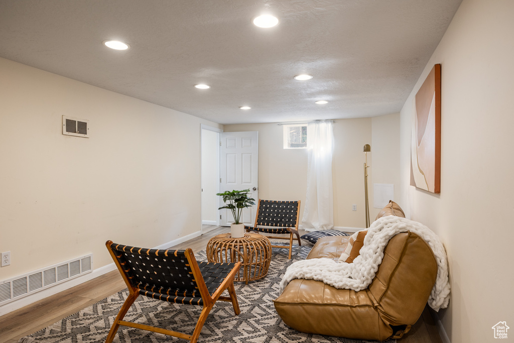 Sitting room featuring wood finished floors and recessed lighting
