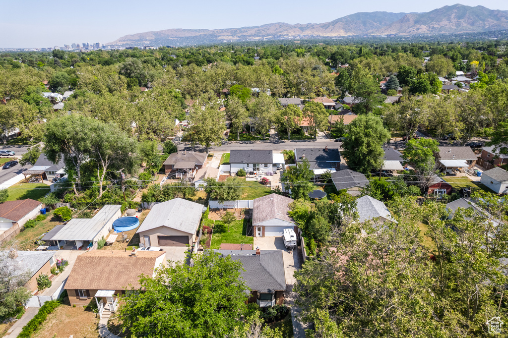 Aerial perspective of suburban area featuring a mountainous background