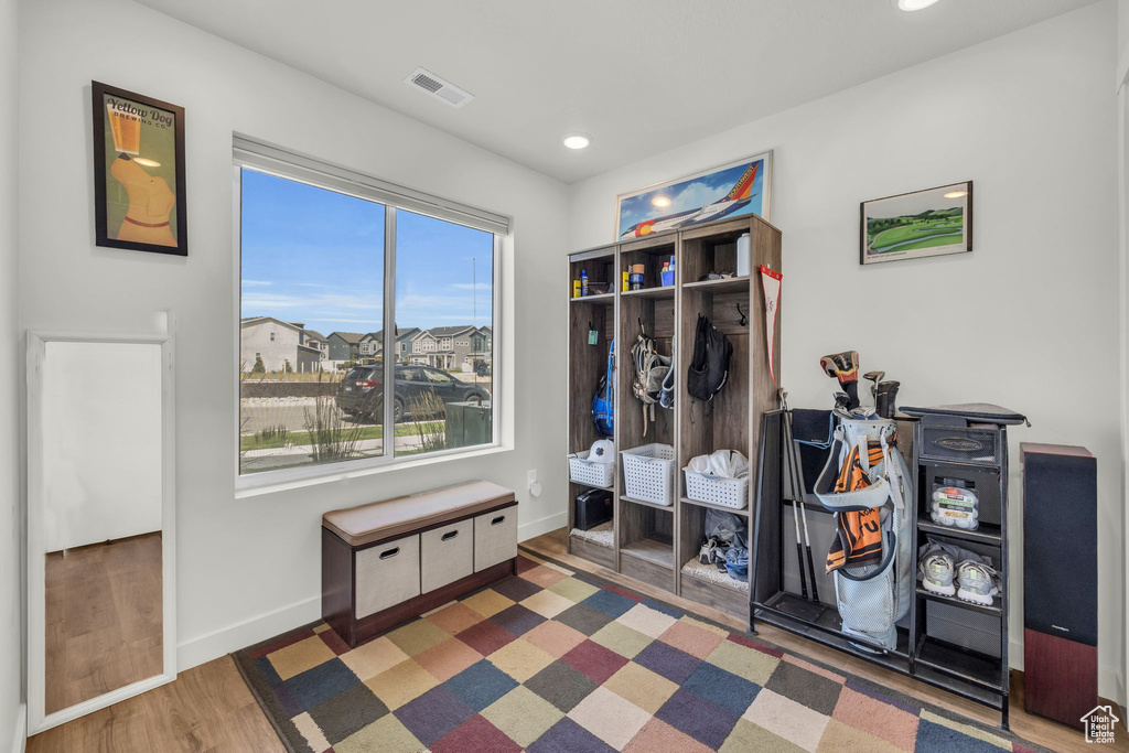Mudroom featuring wood finished floors and recessed lighting
