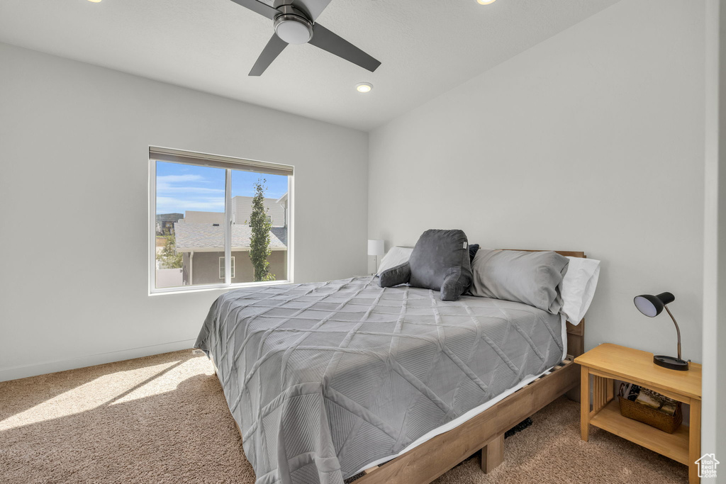 Carpeted bedroom featuring recessed lighting and ceiling fan