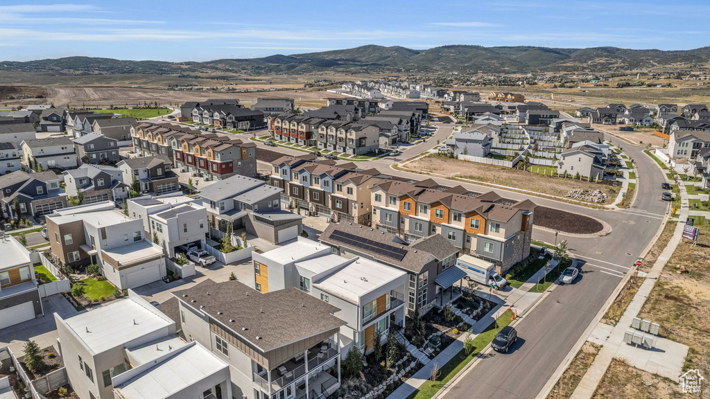Aerial view of residential area featuring a mountain backdrop