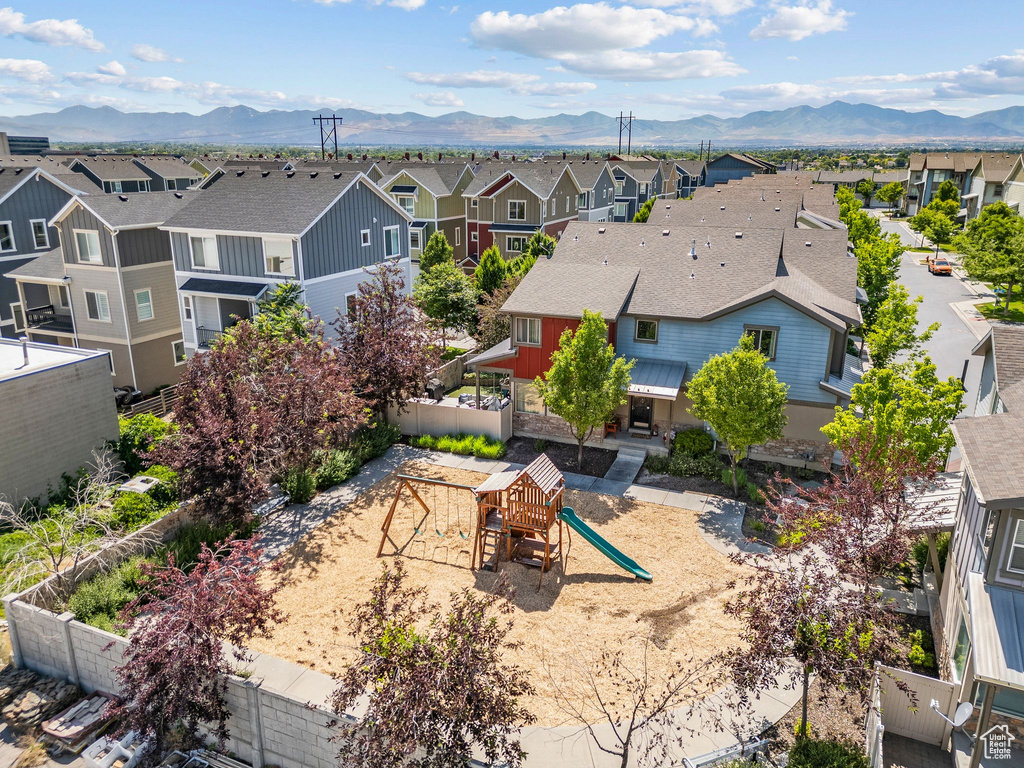 Aerial view of residential area with a mountainous background
