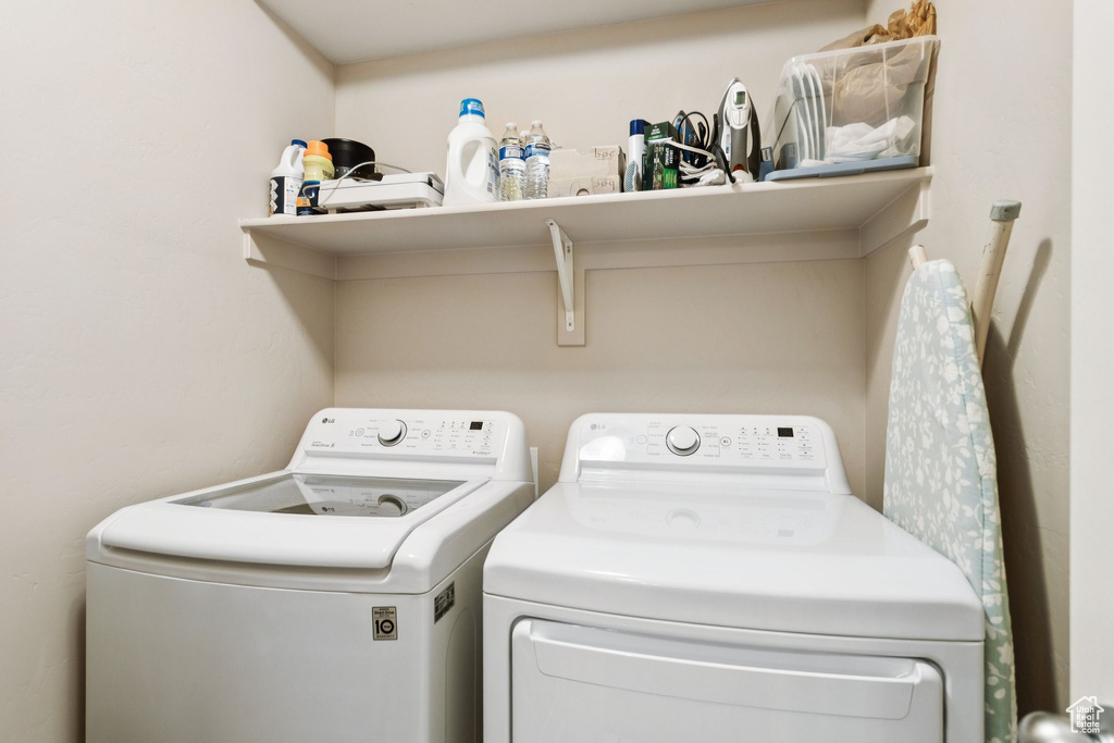 Washroom with washer and clothes dryer