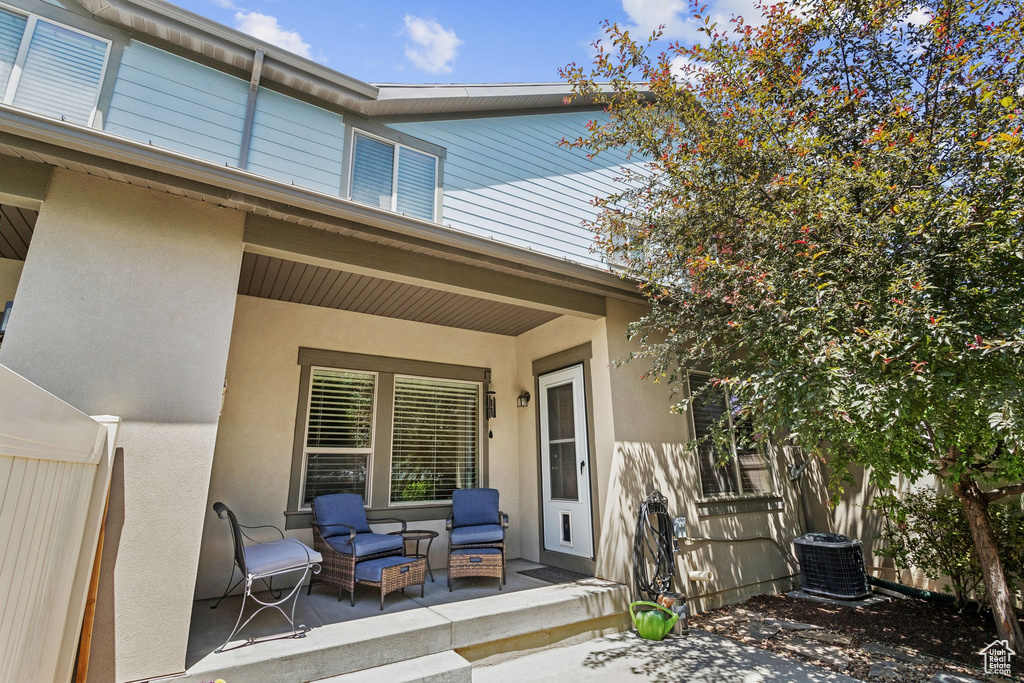 Entrance to property featuring stucco siding