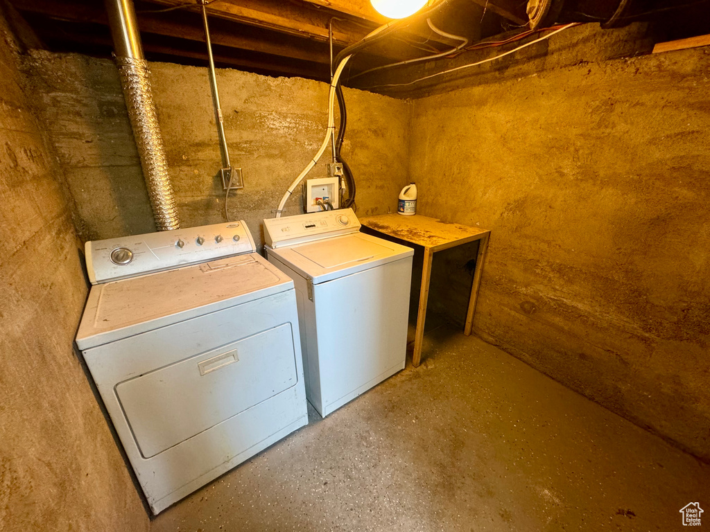 Washroom featuring independent washer and dryer