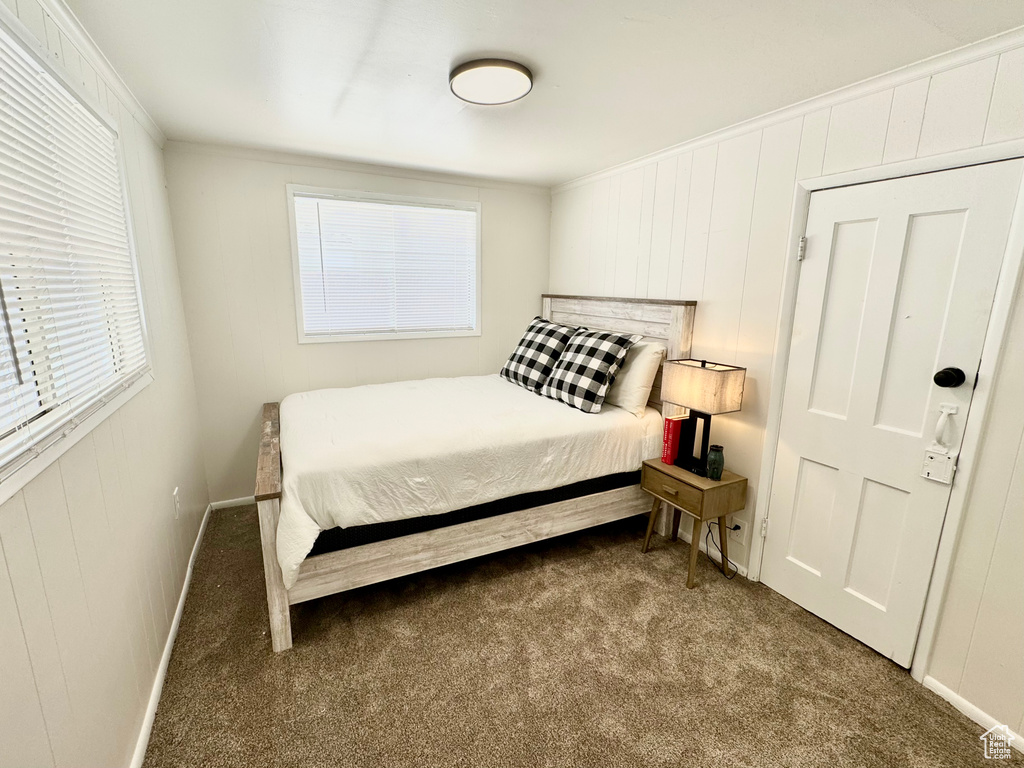 Bedroom with carpet and ornamental molding