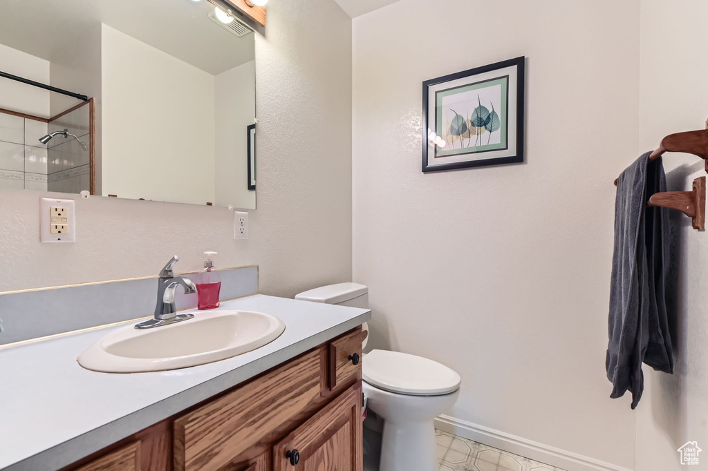 Full bathroom featuring vanity and a shower