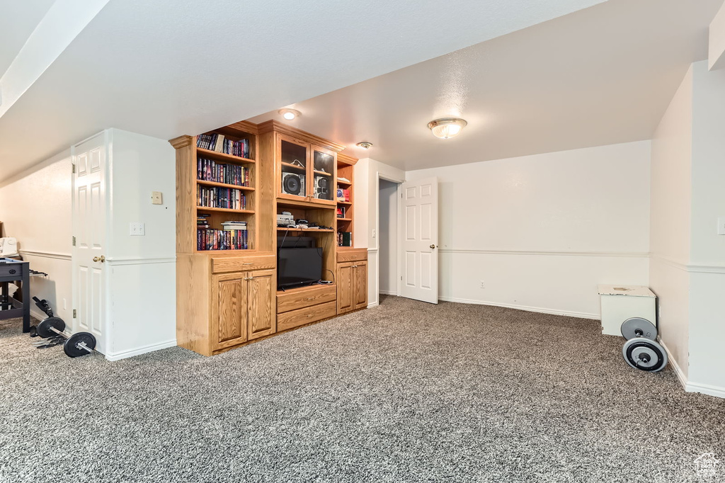 Living room with carpet flooring and baseboards