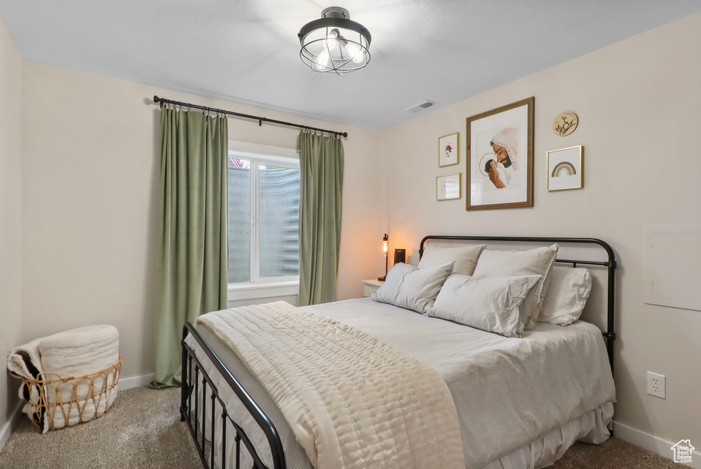 Carpeted bedroom with baseboards