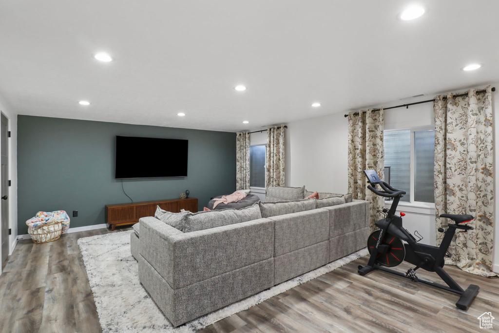 Living room with recessed lighting and wood finished floors