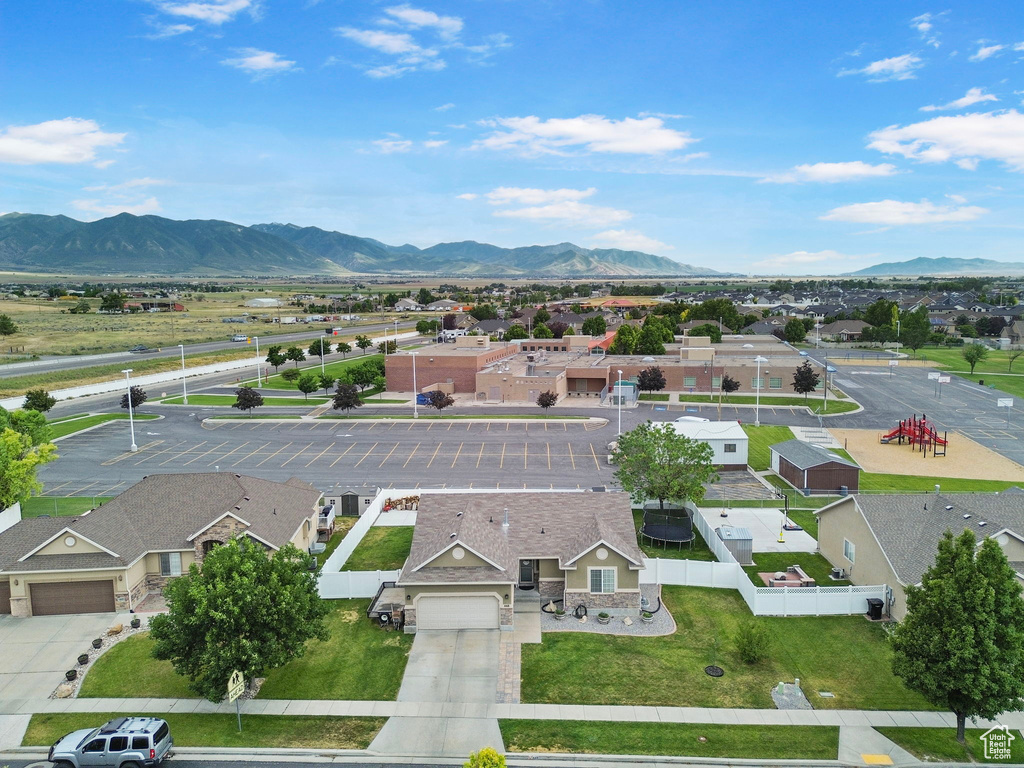 Aerial perspective of suburban area with a mountain backdrop